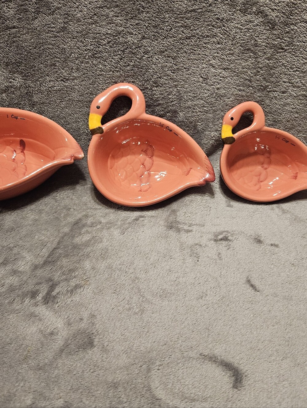 Set of 4 ceramic pink flamingo nesting measuring cups.